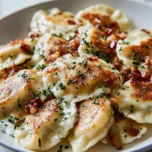 Delicious comfort food pierogies sizzling on the Blackstone grill.